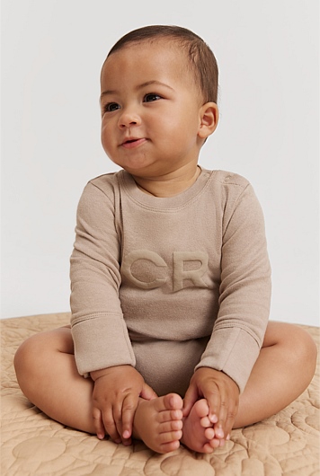 Organically Grown Cotton Puff Logo Long Sleeve Bodysuit