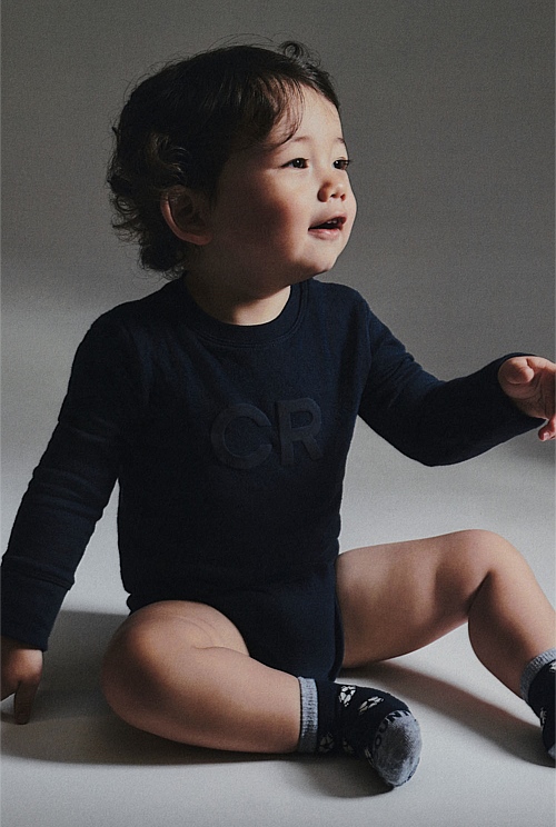 Organically Grown Cotton Puff Logo Long Sleeve Bodysuit