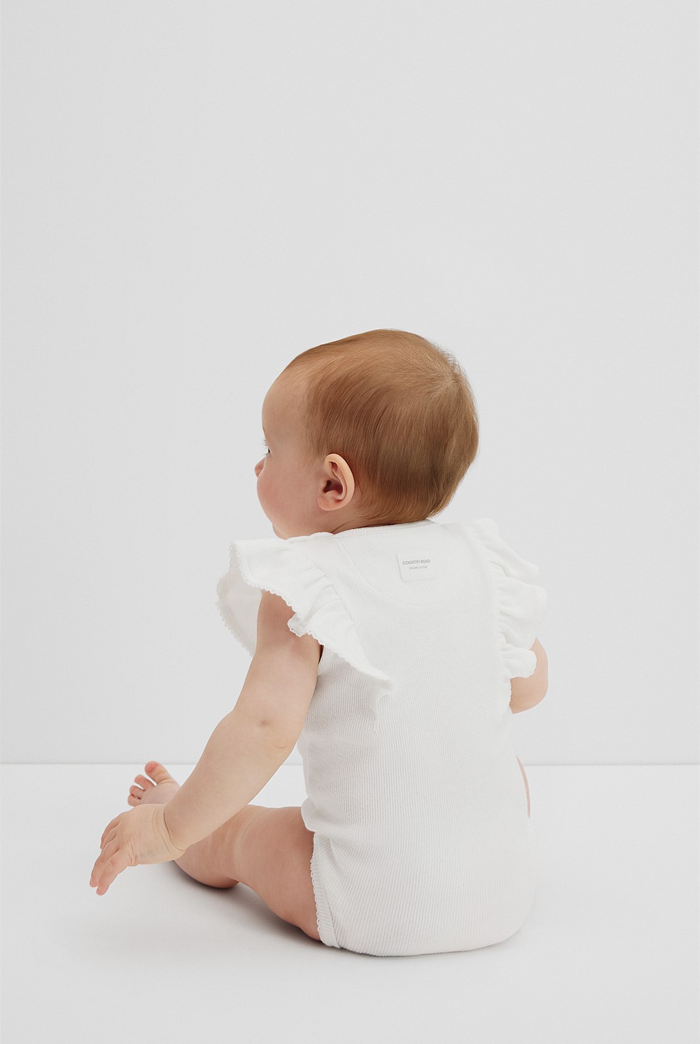 Organically Grown Cotton Rib Frill Bodysuit